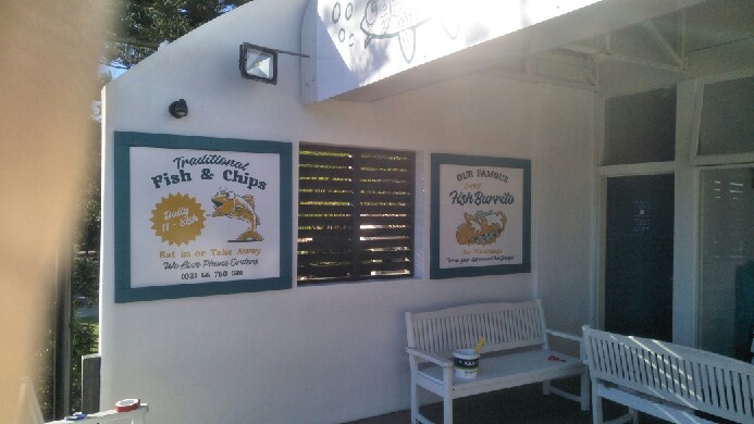 The Stunned Mullet metal awning sign made from aluminium composite material (ACM) to attract street traffic, and printed vinyl graphics sized to fit a painted panels to advertise specials.